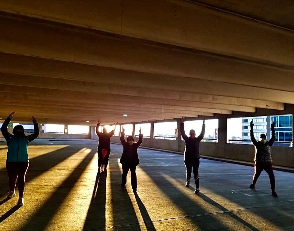 Yoga stretches in the parking lot